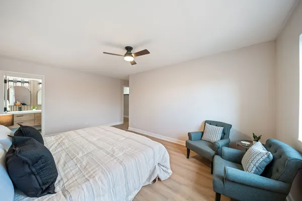 a bedroom with bed and furniture