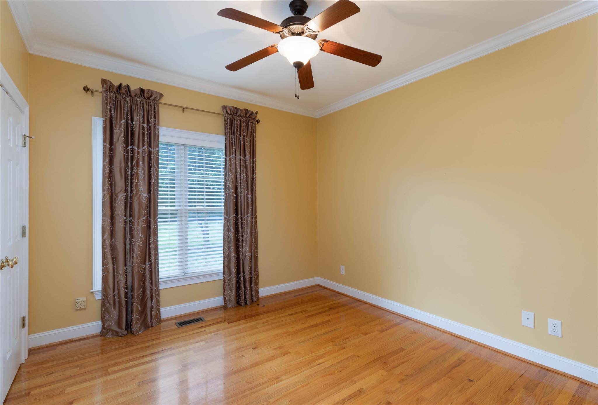 533 Mason Dickson Road York, SC 29745 - Photo 21 of 48 a view of empty room with wooden floor and fan