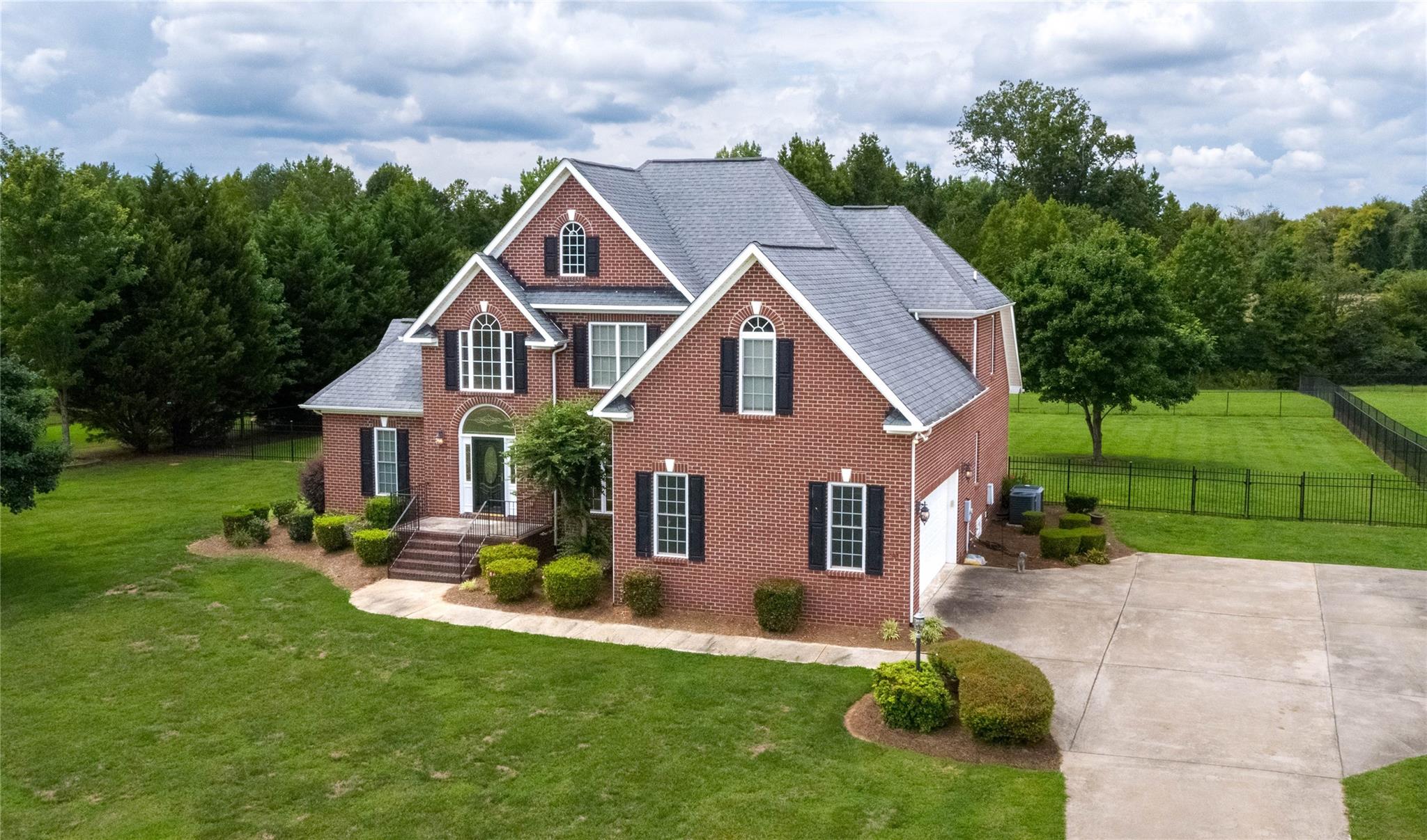 533 Mason Dickson Road York, SC 29745 - Photo 34 of 48 a aerial view of a house with a big yard plants and large trees