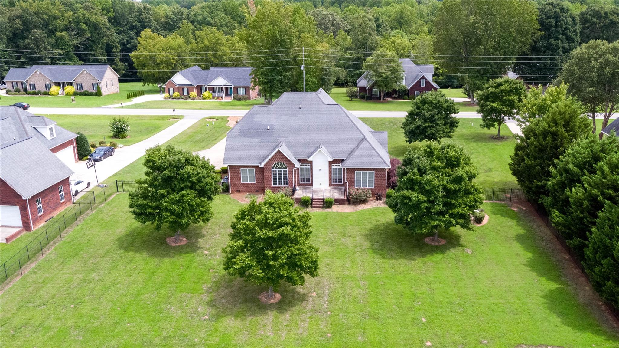 533 Mason Dickson Road York, SC 29745 - Photo 43 of 48 a view of a house with a yard and a garden