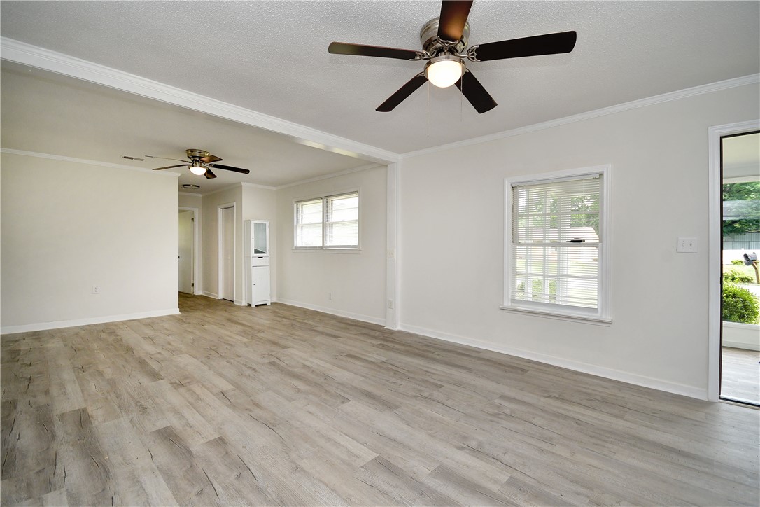 115 Stancil Road Anderson, SC 29625 - Photo 24 of 35 Bright, spacious living area with resilient flooring and crown molding offers versatile design possibilities.