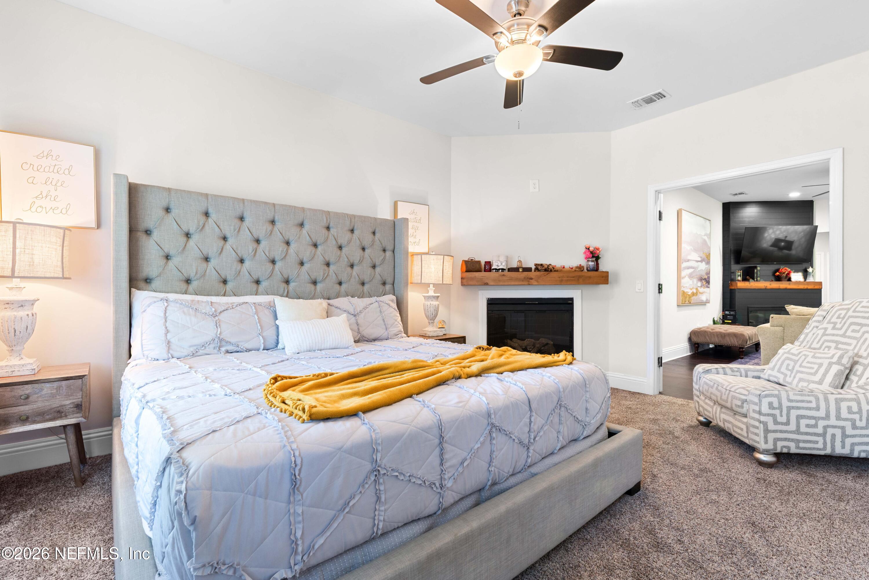 1138 Walnut Street Jacksonville, FL 32206 - Photo 32 of 37 a bedroom with a bed and a fireplace