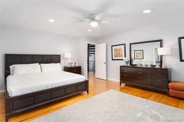 a bedroom with a bed and a couch