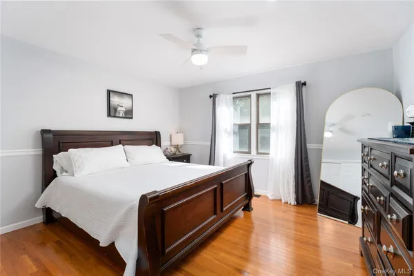 a bed room with a bed and a flat screen tv