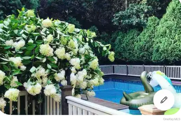 a view of balcony with wooden floor