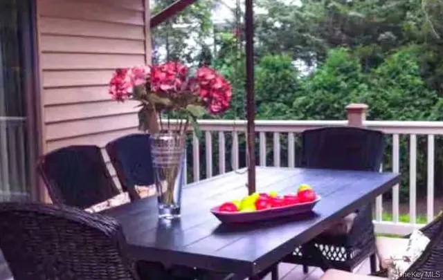a view of a table and chairs in the patio