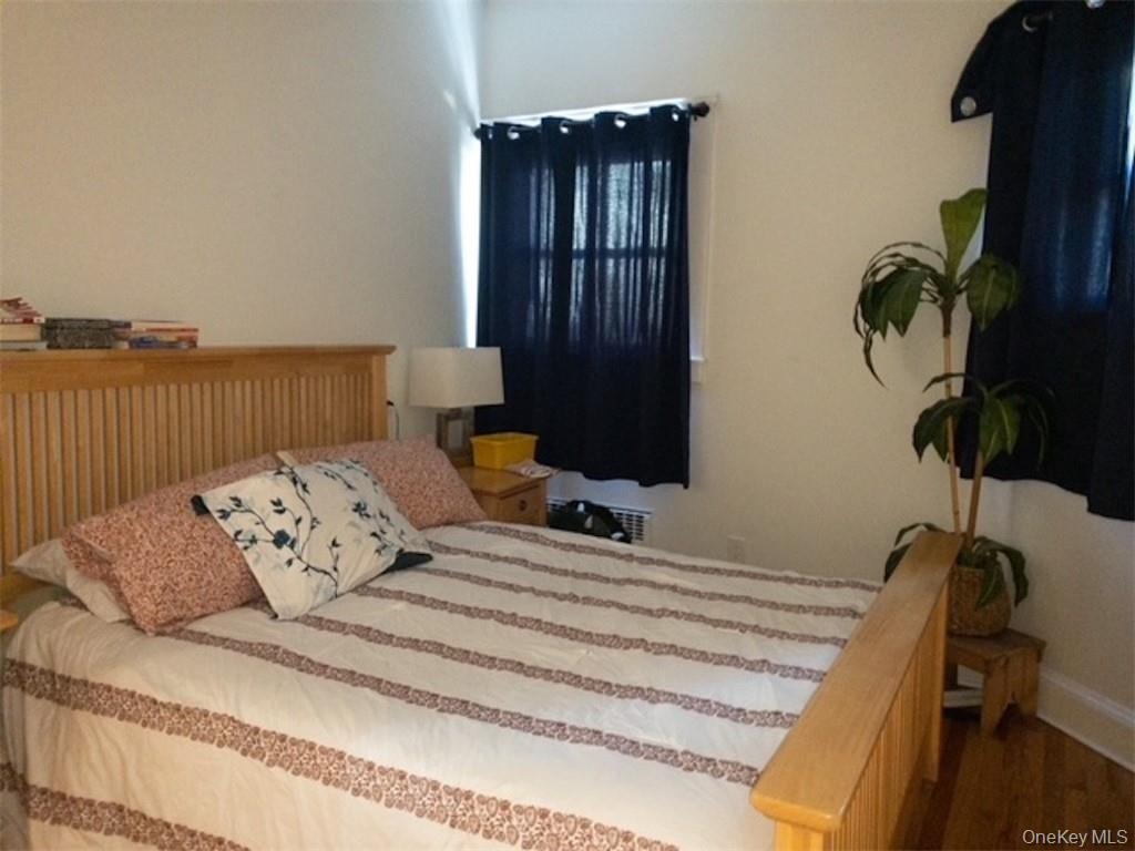 120 Clinton Avenue, Unit 1 Nyack, NY 10960 - Photo 14 of 15 a bedroom with a bed window and flowerpot