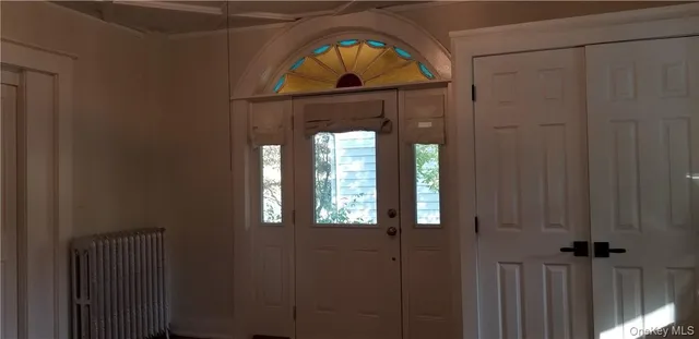 a view of entryway with a front door