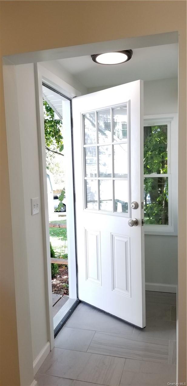 120 Clinton Avenue, Unit 1 Nyack, NY 10960 - Photo 8 of 15 a view of an empty room with a window