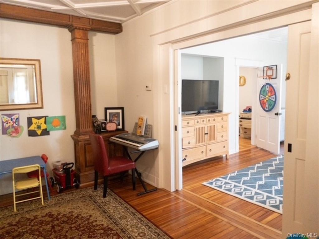 120 Clinton Avenue, Unit 1 Nyack, NY 10960 - Photo 9 of 15 a living room with furniture and a flat screen tv