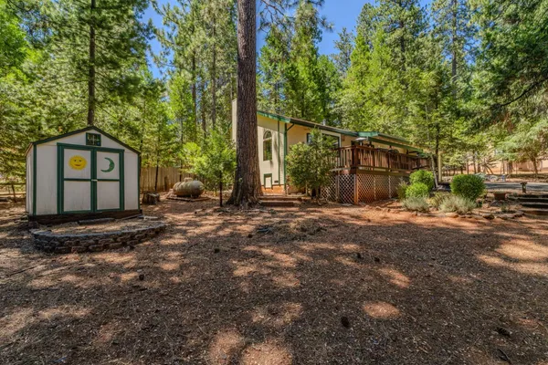 a view of a house with a backyard