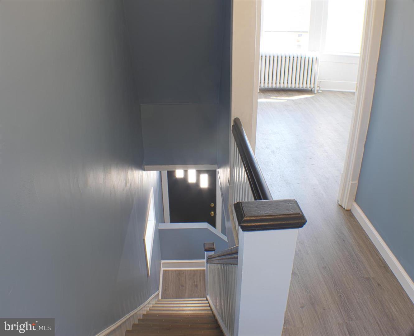 426 Adams Street Pottsville, PA 17901 - Photo 8 of 10 Inviting staircase with natural light.