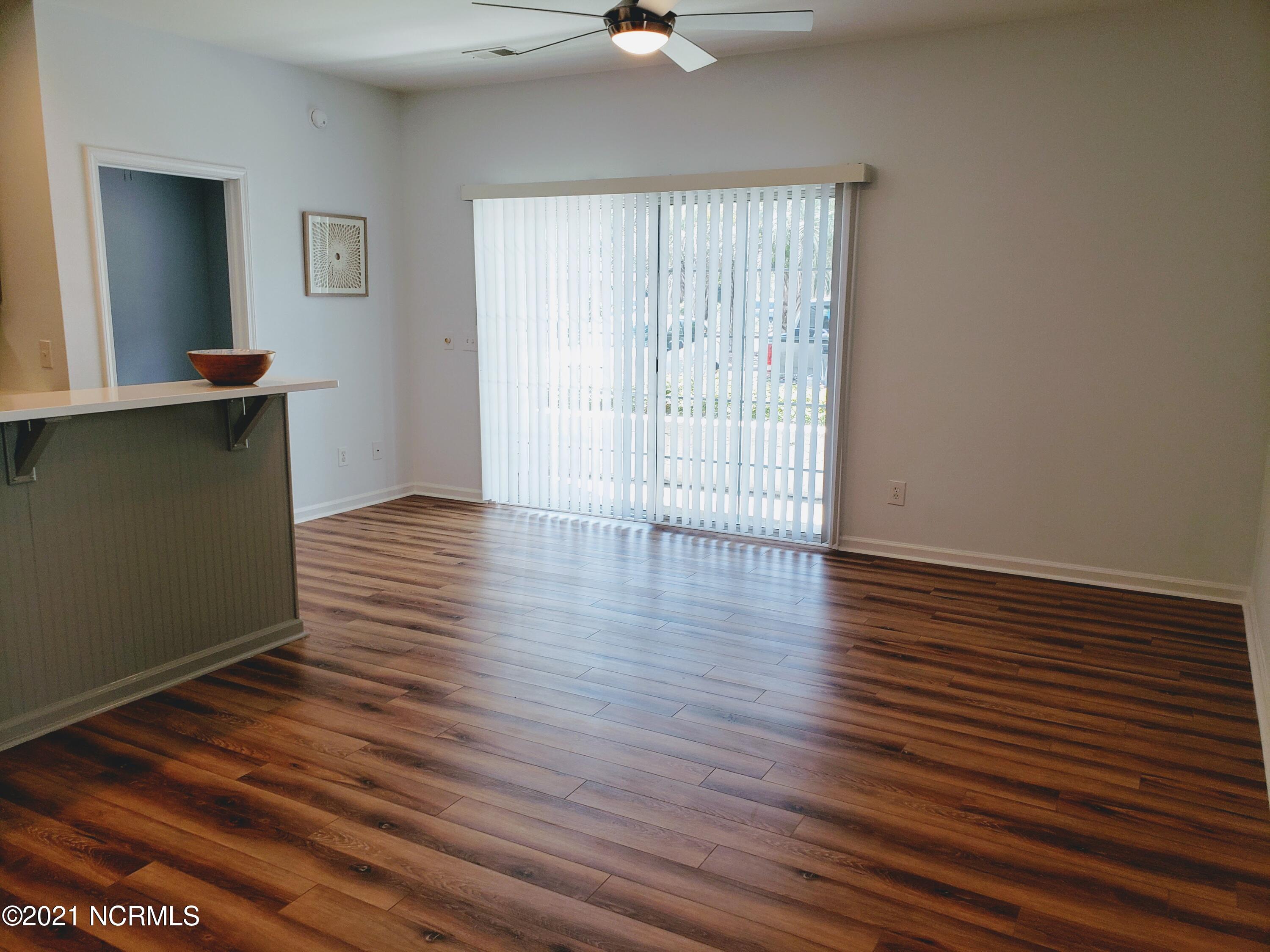 155 Royal Poste Road, Unit 3002 Sunset Beach, NC 28468 - Photo 13 of 20 New LVP Flooring - Living Room. Walk out onto your own covered patio.