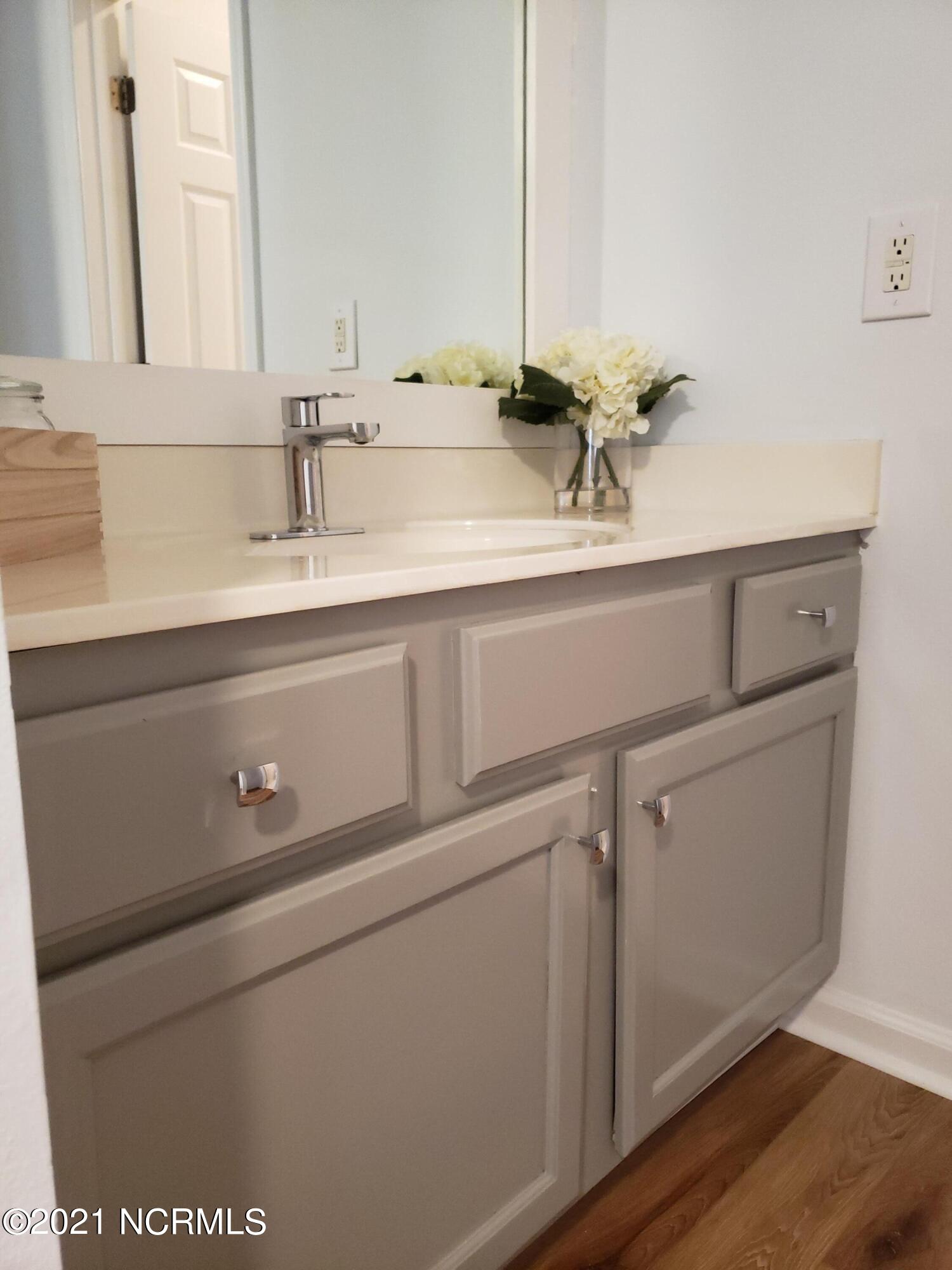 155 Royal Poste Road, Unit 3002 Sunset Beach, NC 28468 - Photo 10 of 20 New Vanity light fixtures, Framed mirrors, Newly Painted cabinets and added chrome hardware.