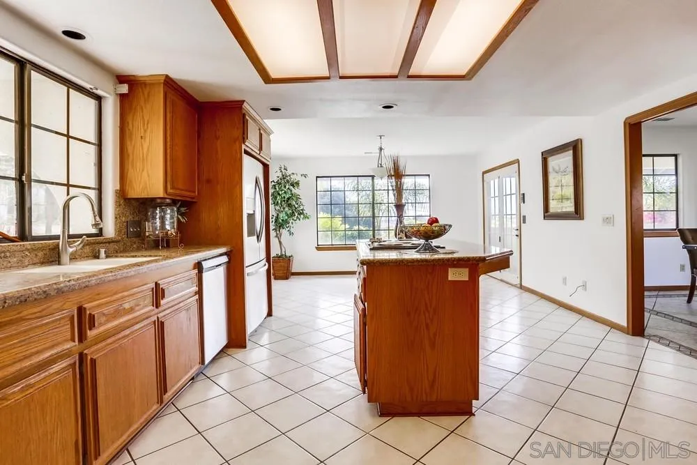 3690 Lupine Lane Fallbrook, CA 92028 - Photo 11 of 37 a kitchen with stainless steel appliances granite countertop a refrigerator and a sink
