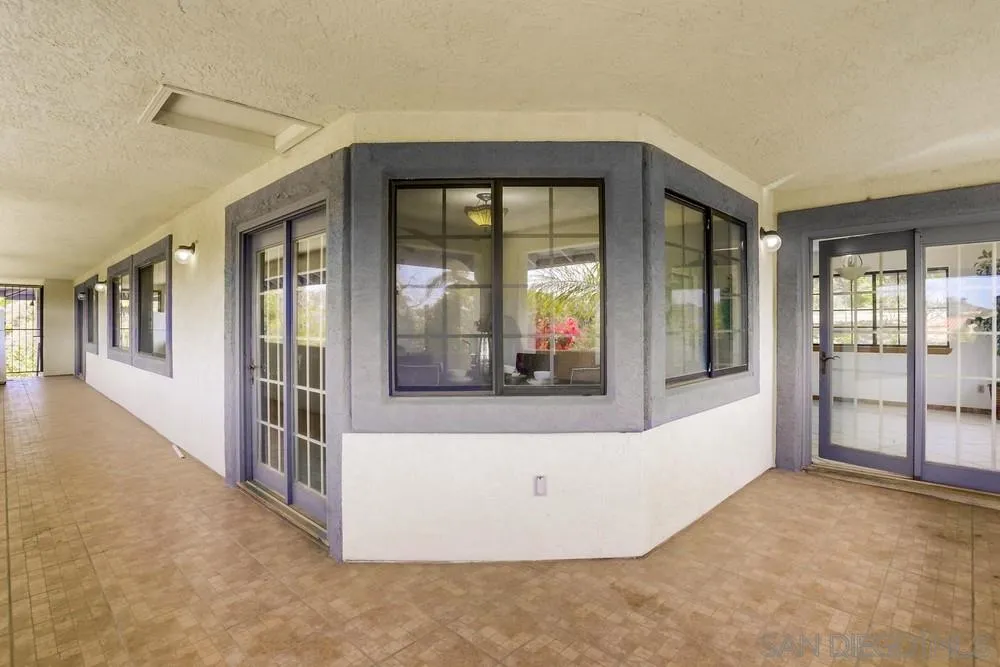 3690 Lupine Lane Fallbrook, CA 92028 - Photo 15 of 37 a view of a big room with windows and chandelier