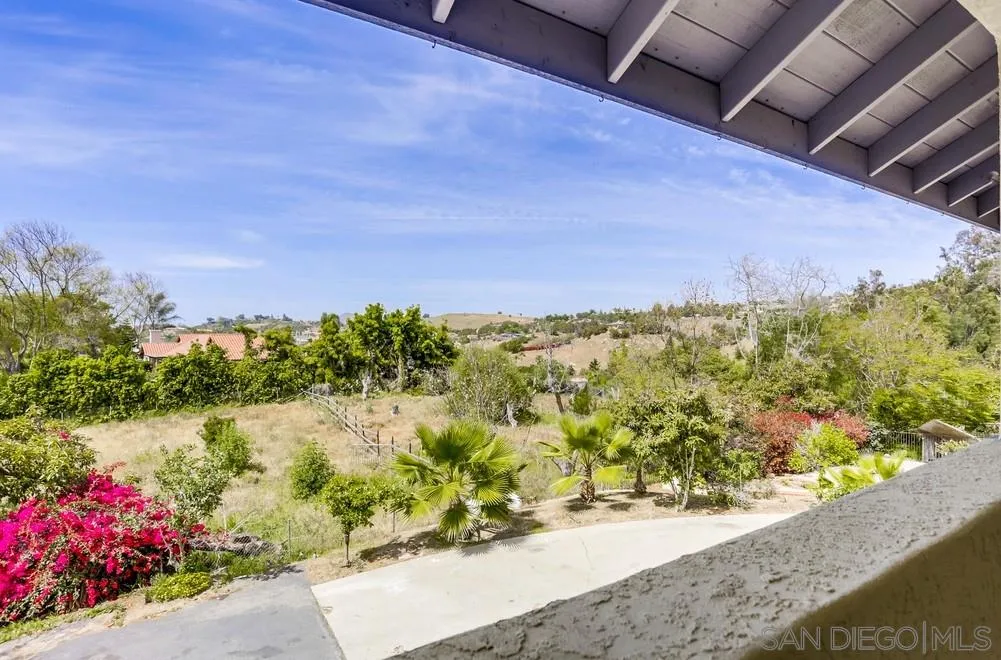 3690 Lupine Lane Fallbrook, CA 92028 - Photo 16 of 37 a view of a pathway both side of house with wooden fence