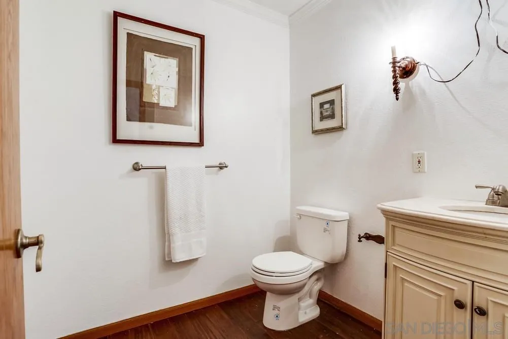 3690 Lupine Lane Fallbrook, CA 92028 - Photo 18 of 37 a white toilet sitting next to a bathroom sink