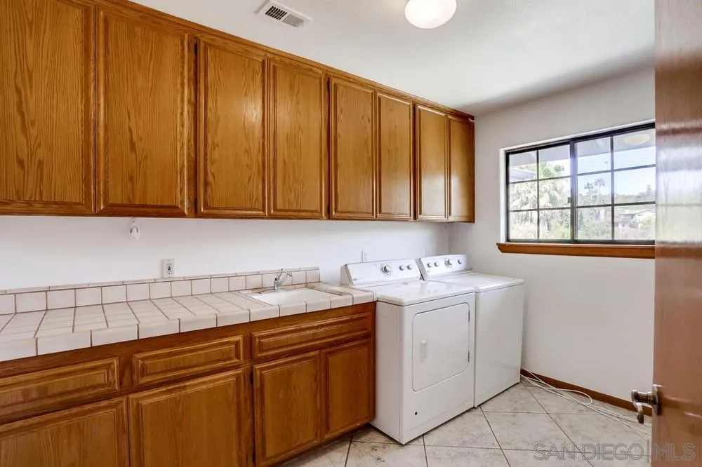 3690 Lupine Lane Fallbrook, CA 92028 - Photo 26 of 37 a view of cabinets with wooden cabinets
