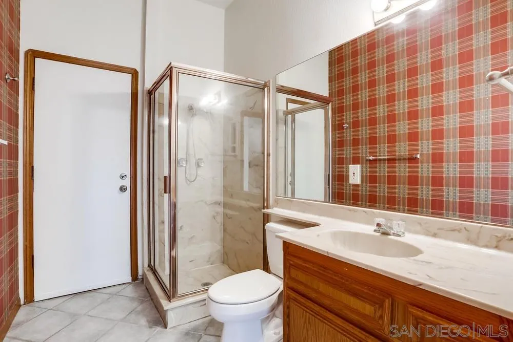 3690 Lupine Lane Fallbrook, CA 92028 - Photo 32 of 37 a bathroom with a sink and a mirror