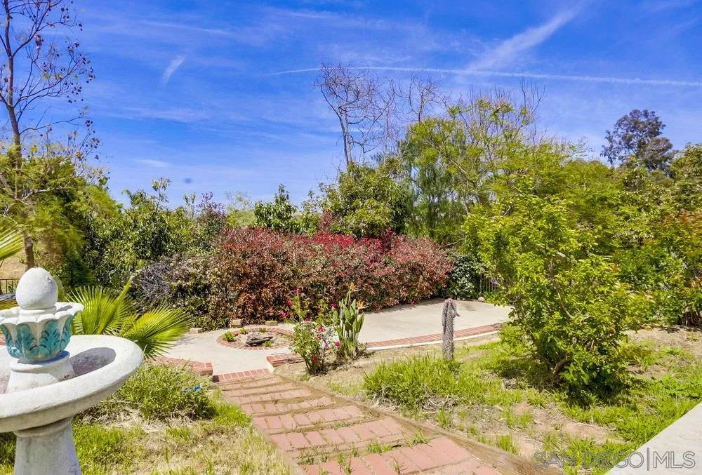 3690 Lupine Lane Fallbrook, CA 92028 - Photo 37 of 37 a patio with table and chairs and potted plants