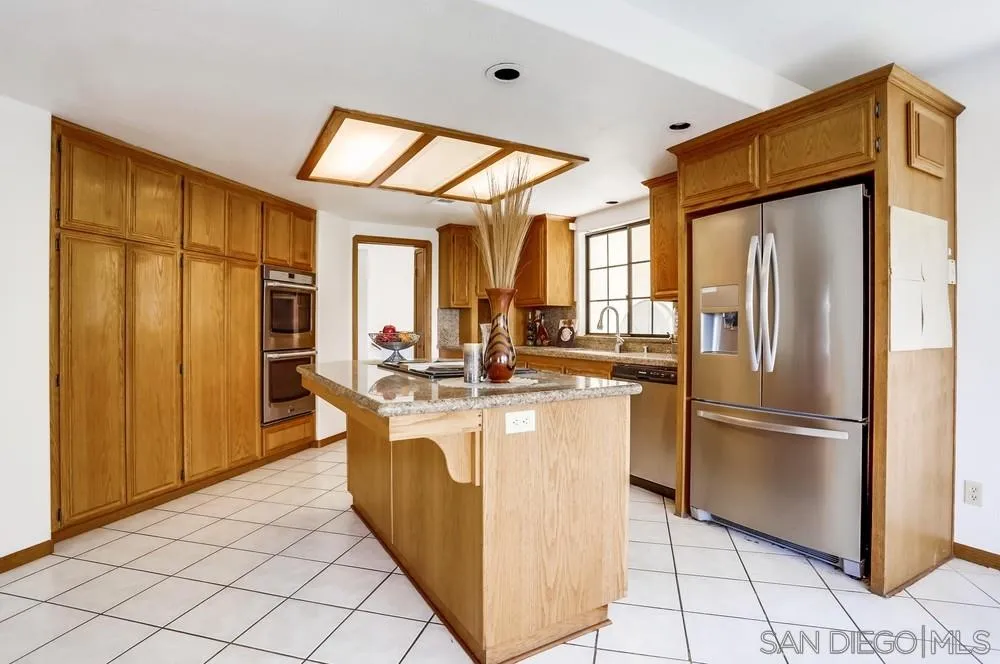 3690 Lupine Lane Fallbrook, CA 92028 - Photo 10 of 37 a kitchen with stainless steel appliances granite countertop a refrigerator a sink and a cabinets