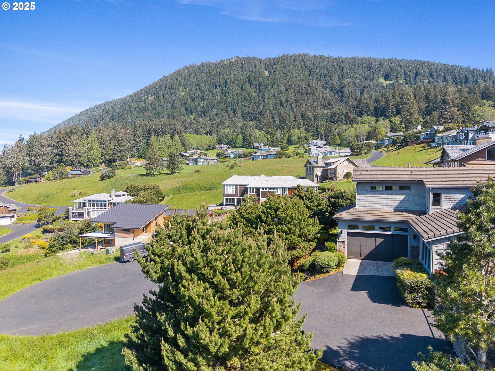 Tides Trail Nehalem, OR 97131 - Photo 9 of 16 a view of a water with mountains in the background
