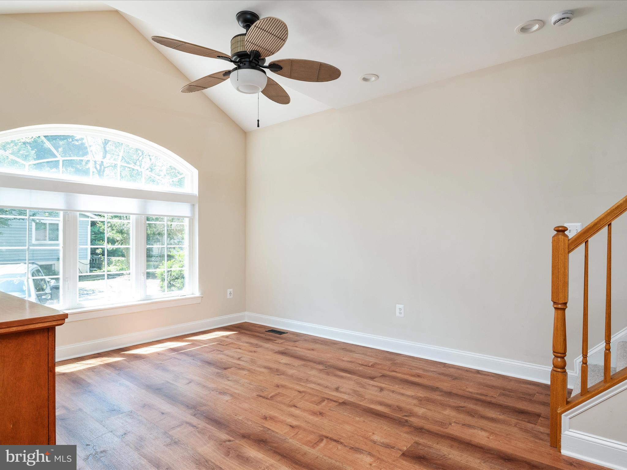 23 Elm Road Riva, MD 21140 - Photo 16 of 66 an empty room with wooden floor fan and windows