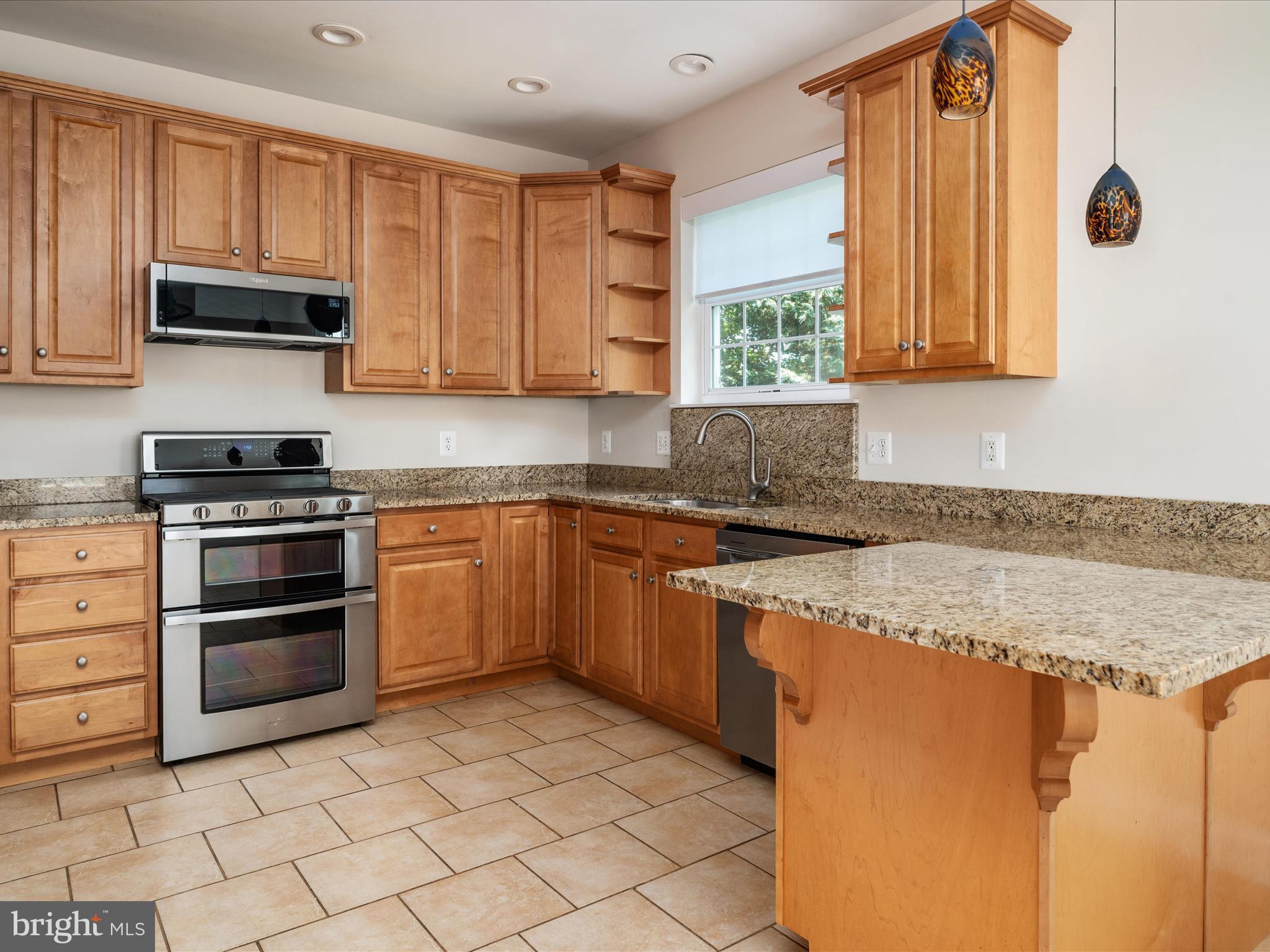 23 Elm Road Riva, MD 21140 - Photo 21 of 66 a kitchen with stainless steel appliances granite countertop a stove a sink and a microwave