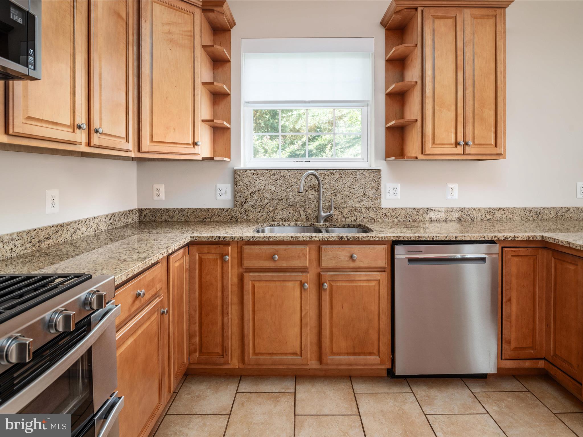 23 Elm Road Riva, MD 21140 - Photo 23 of 66 a kitchen with stainless steel appliances granite countertop a sink stove and cabinets