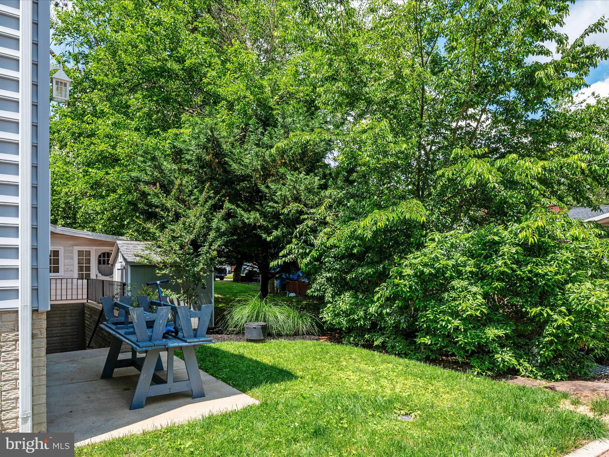 23 Elm Road Riva, MD 21140 - Photo 42 of 66 a view of a backyard with table and chairs and potted plants