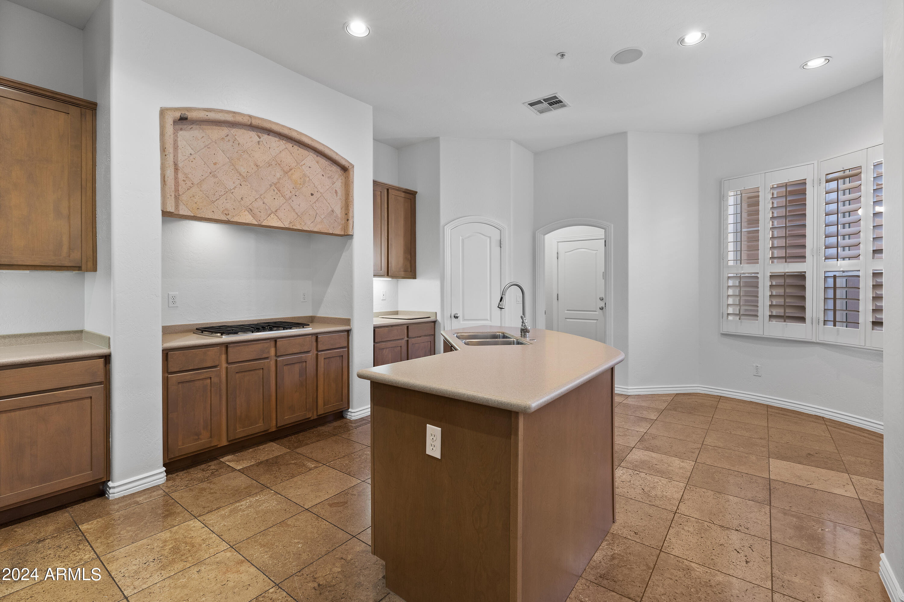 8883 East Mountain Spring Road Scottsdale, AZ 85255 - Photo 13 of 48 a kitchen with a sink a stove and cabinets