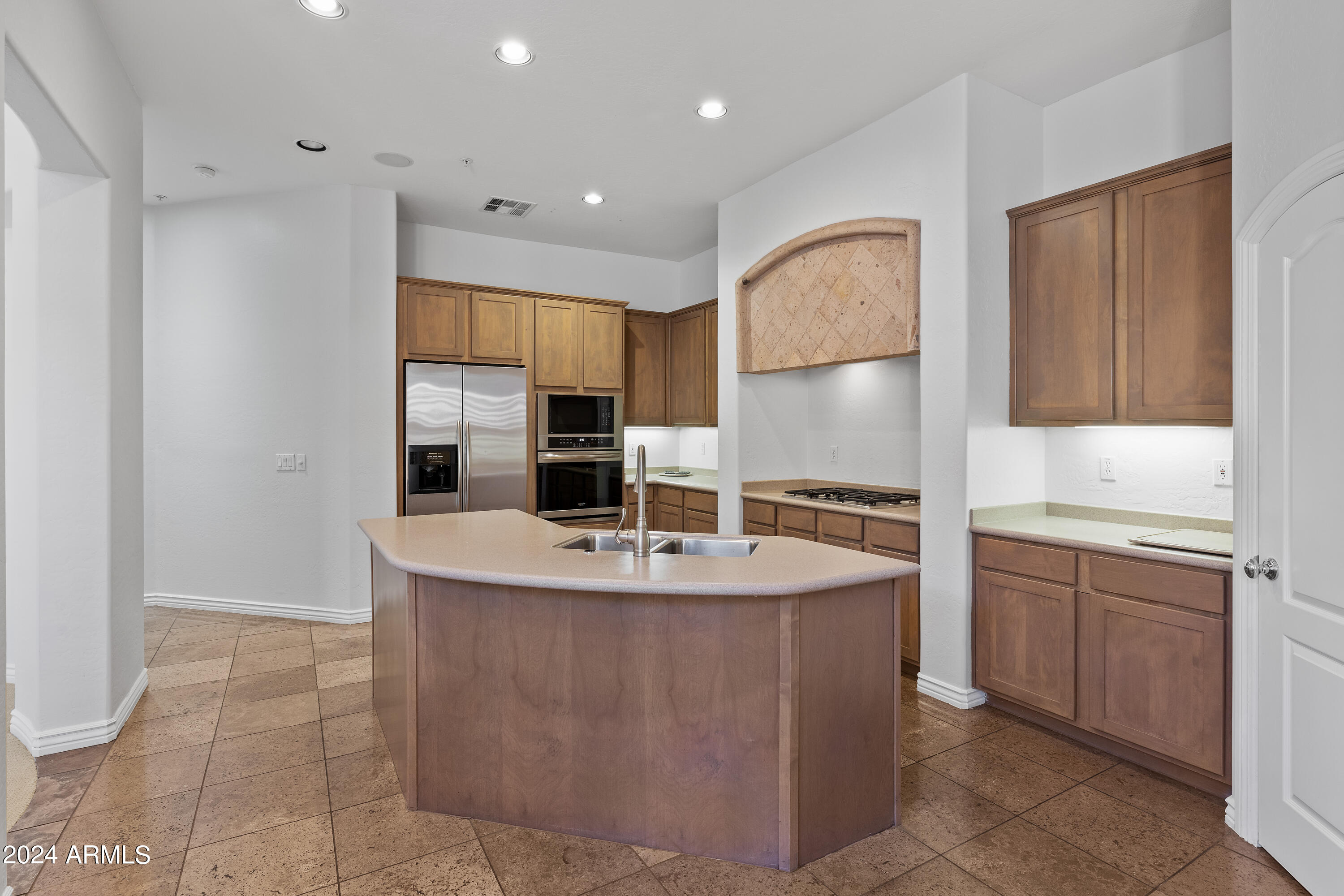 8883 East Mountain Spring Road Scottsdale, AZ 85255 - Photo 14 of 48 a kitchen with stainless steel appliances granite countertop a sink a stove and a refrigerator