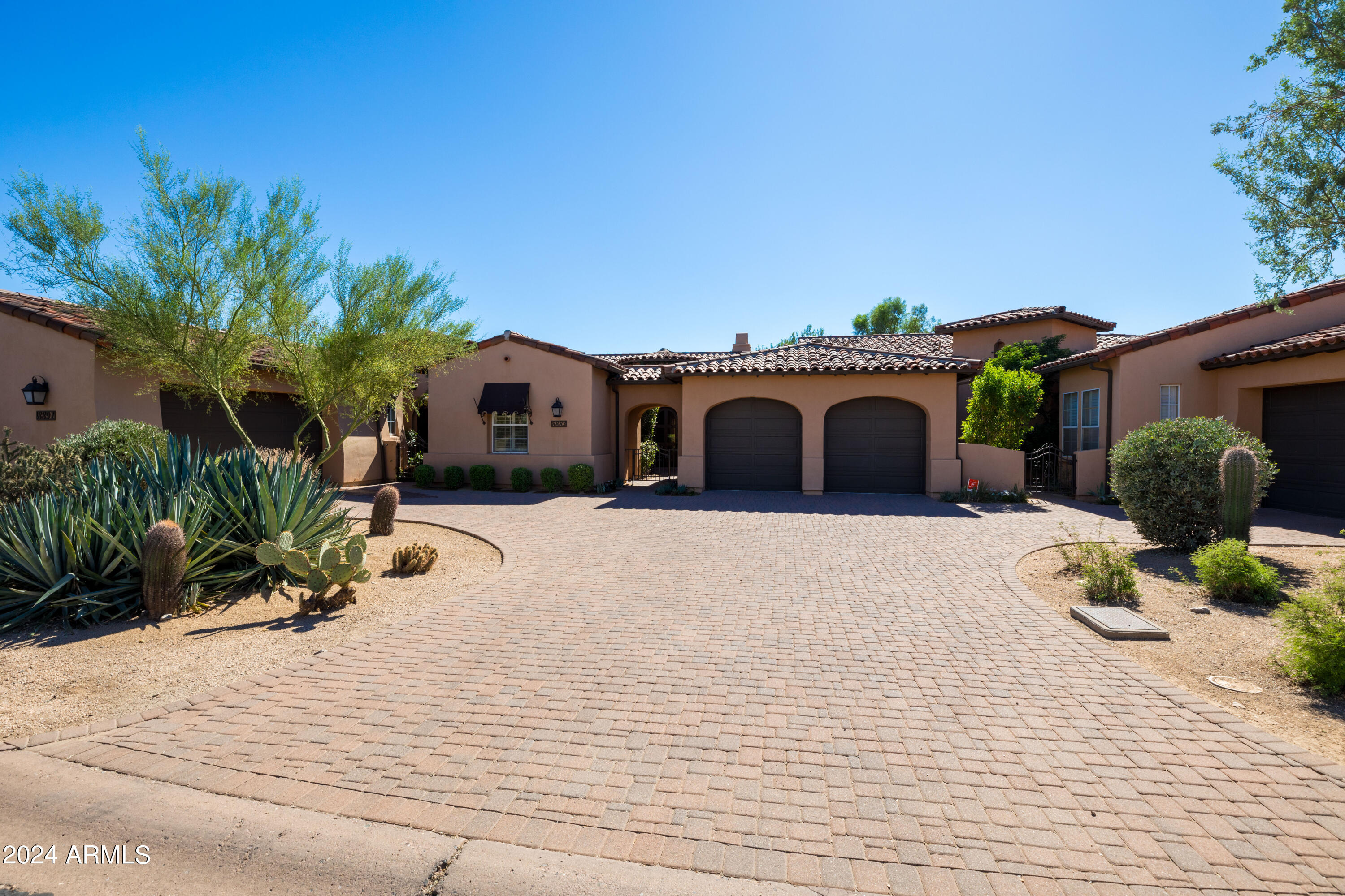 8883 East Mountain Spring Road Scottsdale, AZ 85255 - Photo 2 of 48 a large house with a large space and garden space