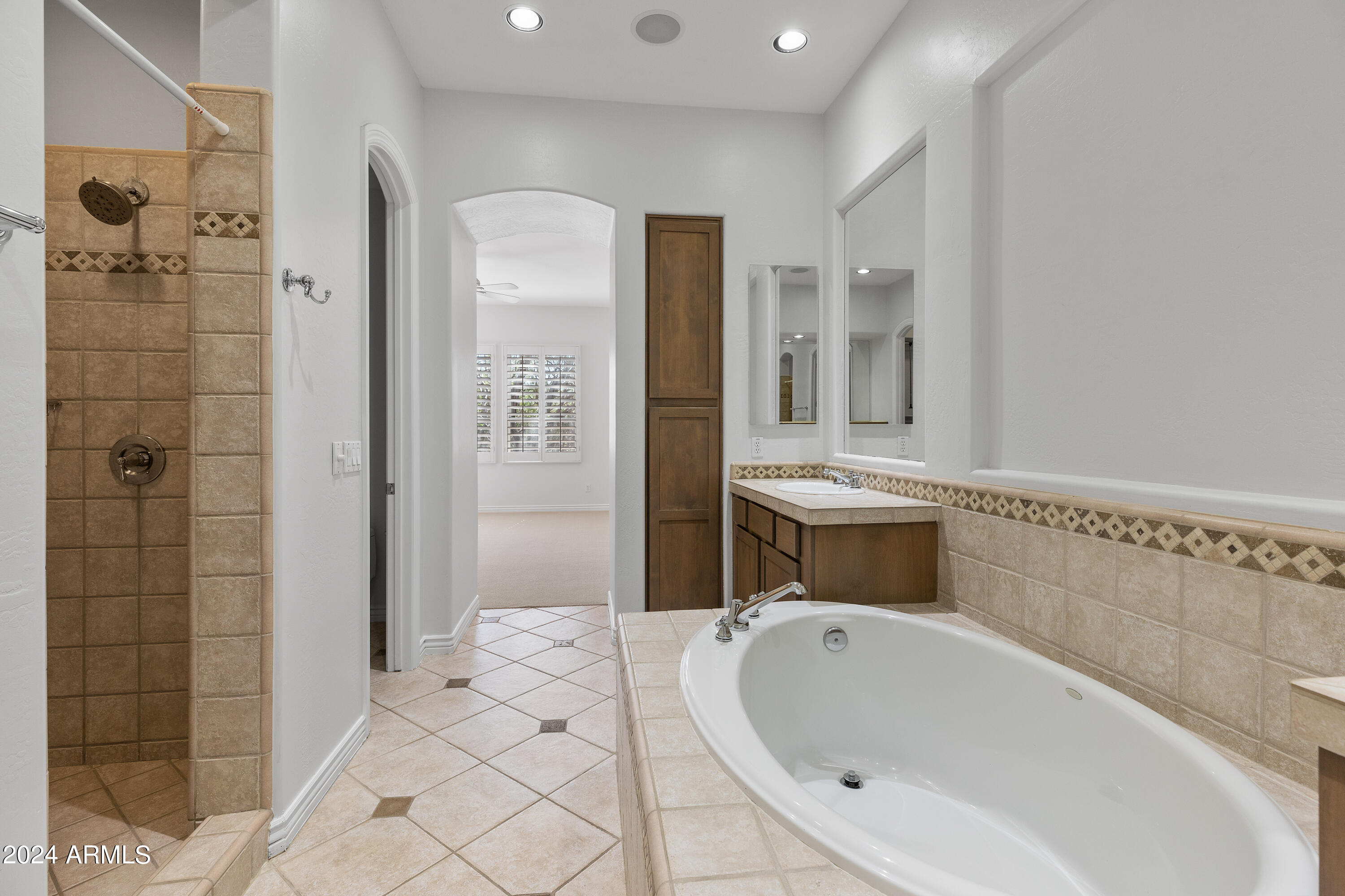 8883 East Mountain Spring Road Scottsdale, AZ 85255 - Photo 21 of 48 a bathroom with a bathtub sink and toilet