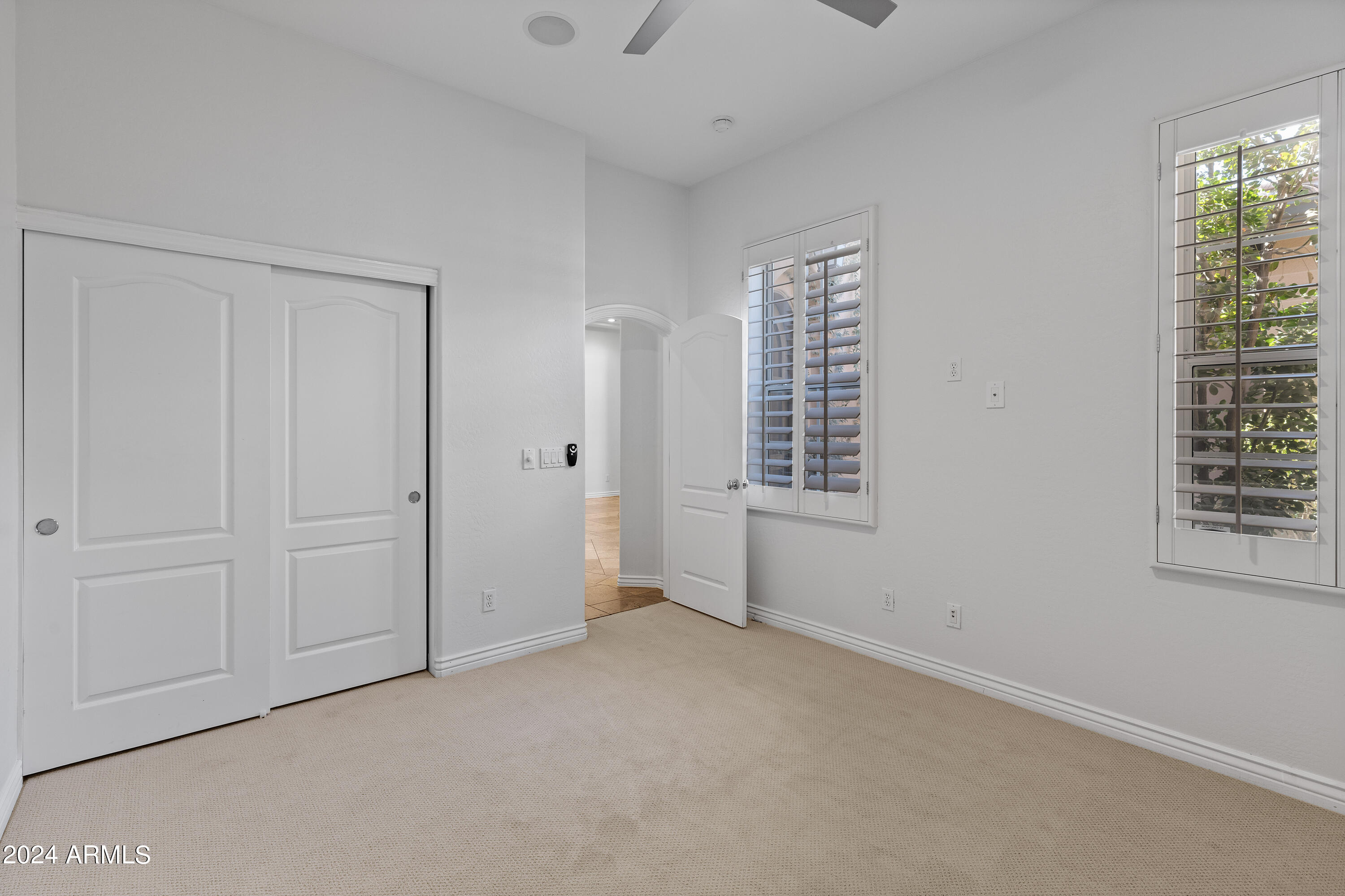 8883 East Mountain Spring Road Scottsdale, AZ 85255 - Photo 25 of 48 an empty room with windows