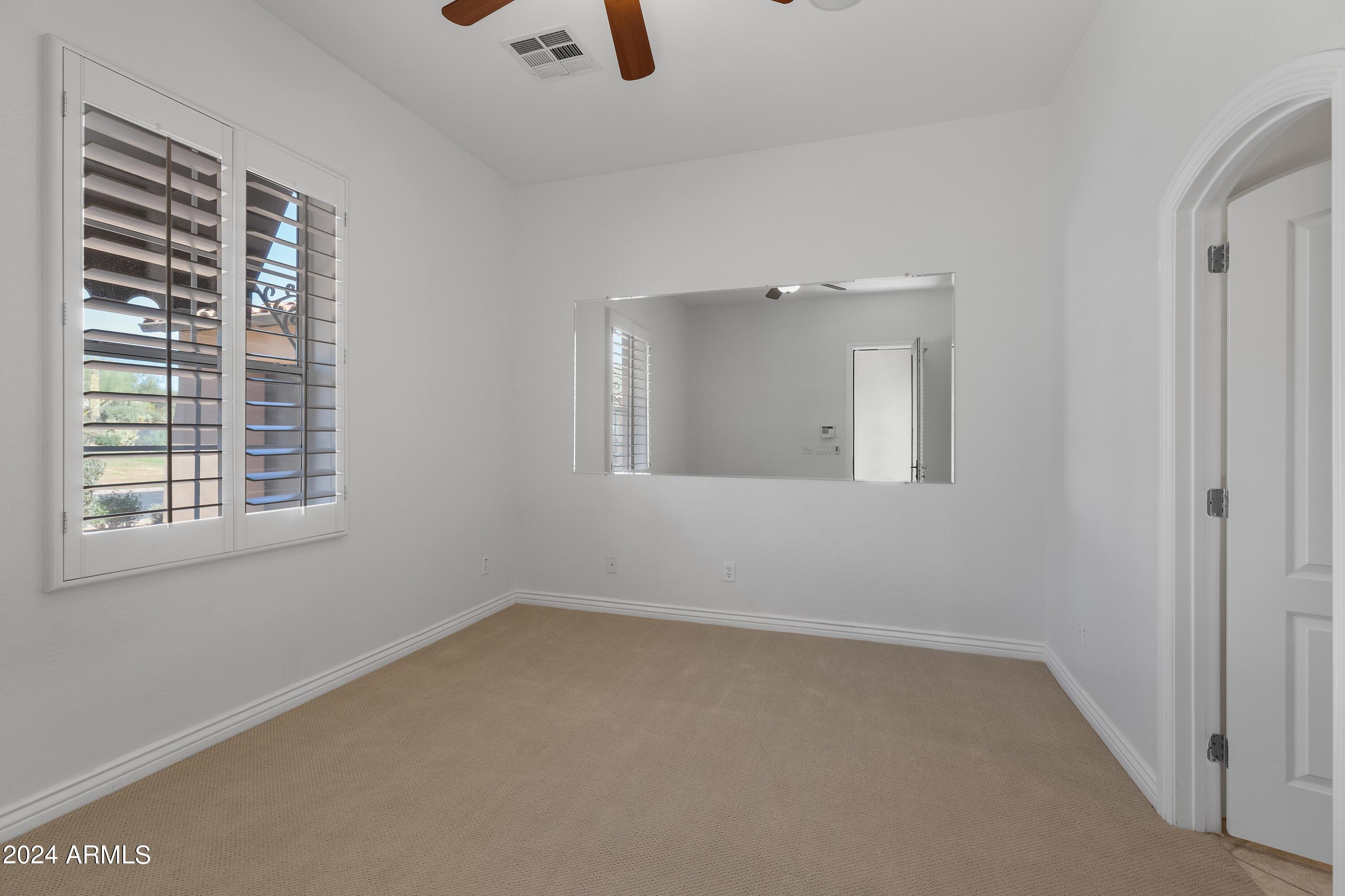 8883 East Mountain Spring Road Scottsdale, AZ 85255 - Photo 30 of 48 an empty room with a window