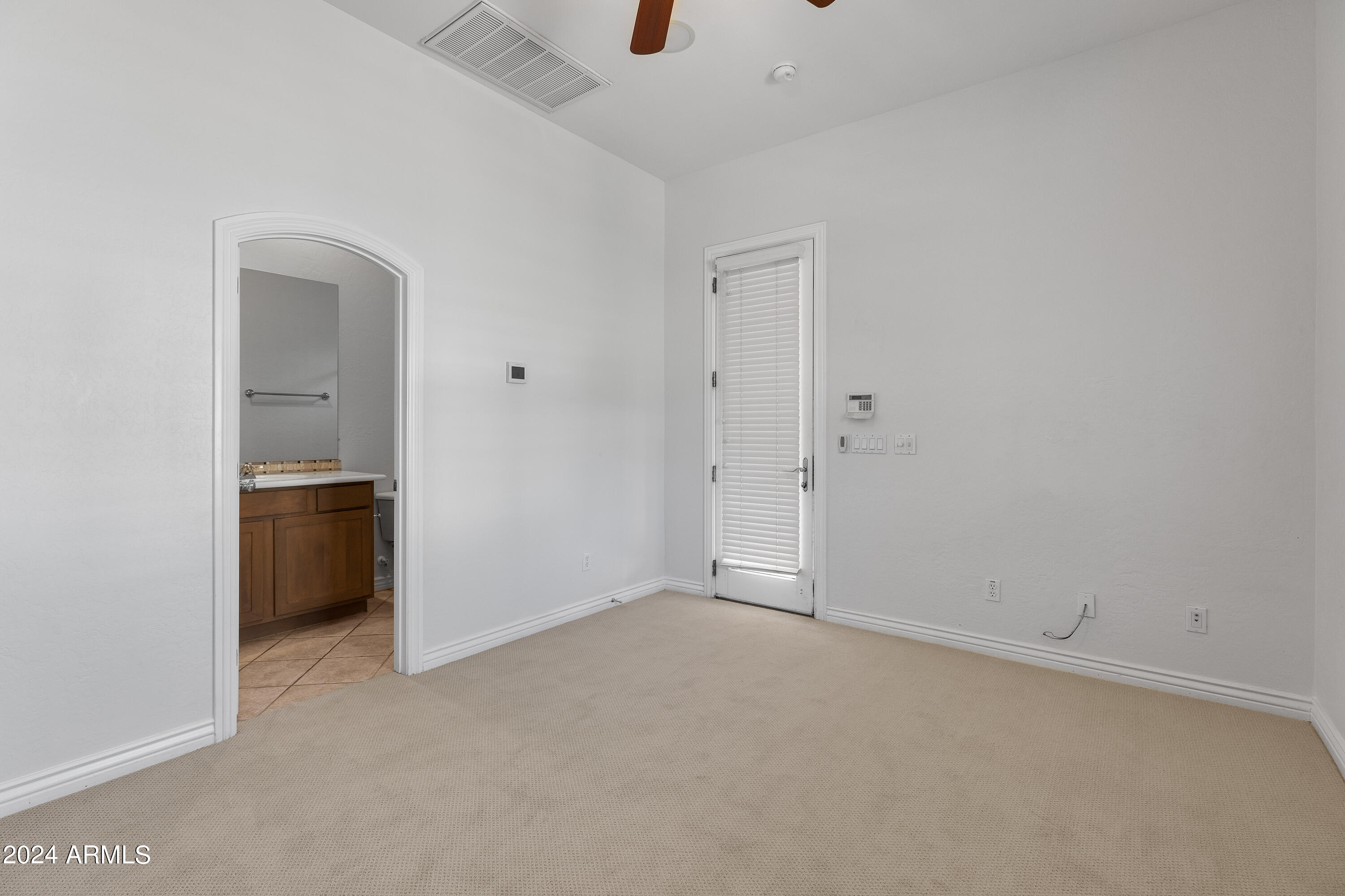 8883 East Mountain Spring Road Scottsdale, AZ 85255 - Photo 31 of 48 a view of an empty room with a kitchen