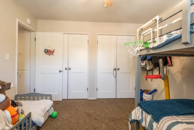 a bedroom with a bed and a table in it