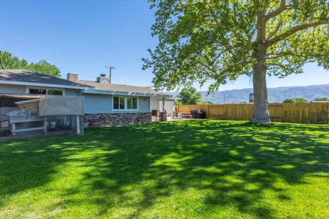 a view of a house with a yard porch and sitting area