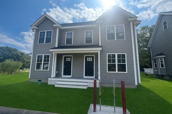 7 Ambrose Way, Unit 5 Shirley, MA 01464 - Photo 2 of 16 a house view with a garden space