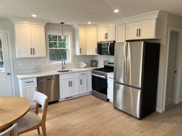 7 Ambrose Way, Unit 5 Shirley, MA 01464 - Photo 6 of 16 a kitchen with stainless steel appliances a refrigerator stove microwave and sink