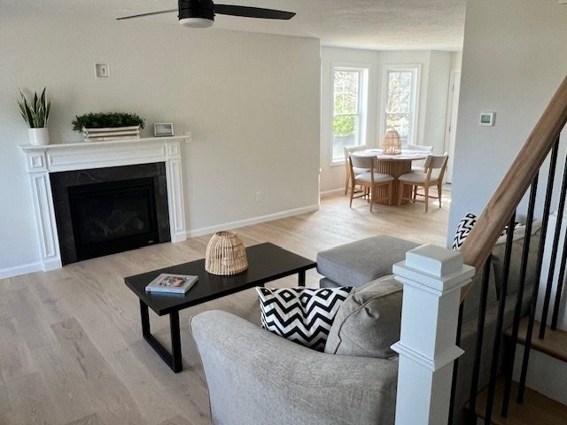 7 Ambrose Way, Unit 5 Shirley, MA 01464 - Photo 7 of 16 a living room with furniture and a fireplace