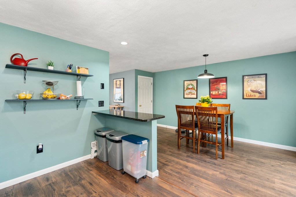 12 Oak Ridge Drive, Unit 3 Maynard, MA 01754 - Photo 11 of 34 a workspace with furniture and wooden floor