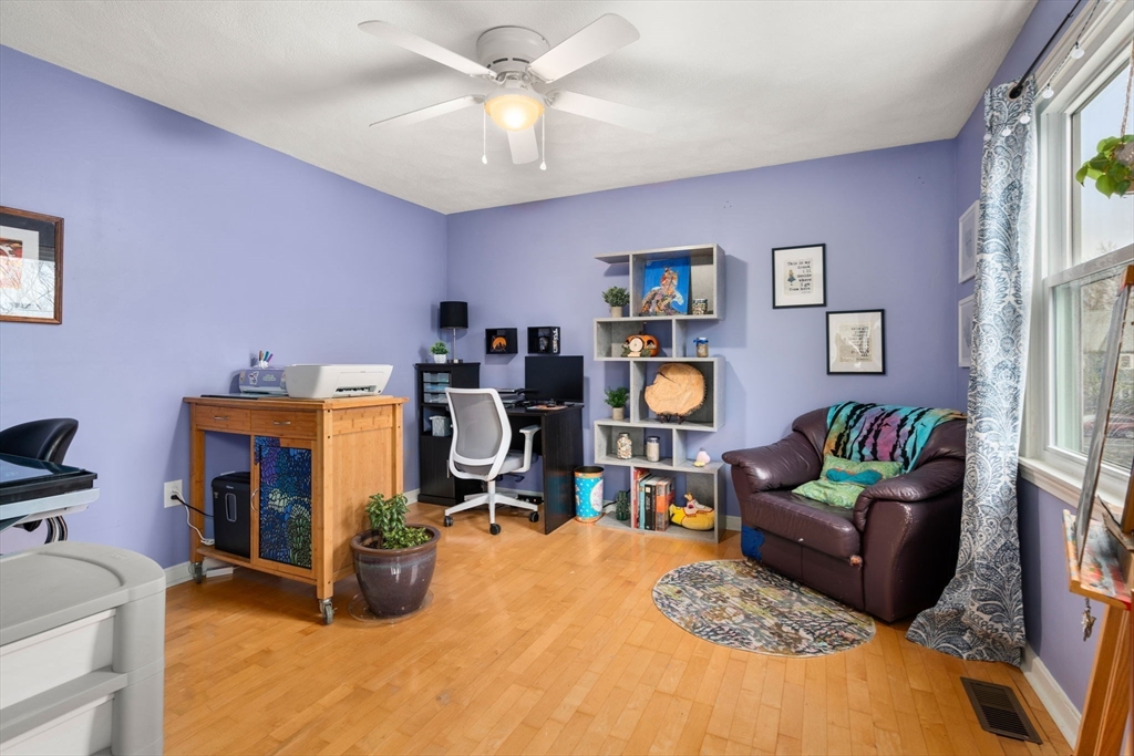 12 Oak Ridge Drive, Unit 3 Maynard, MA 01754 - Photo 15 of 34 a living room with furniture and a flat screen tv