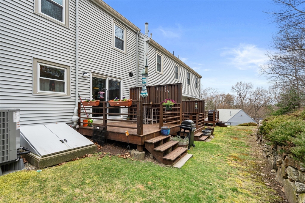 12 Oak Ridge Drive, Unit 3 Maynard, MA 01754 - Photo 27 of 34 a view of a house with backyard and sitting area