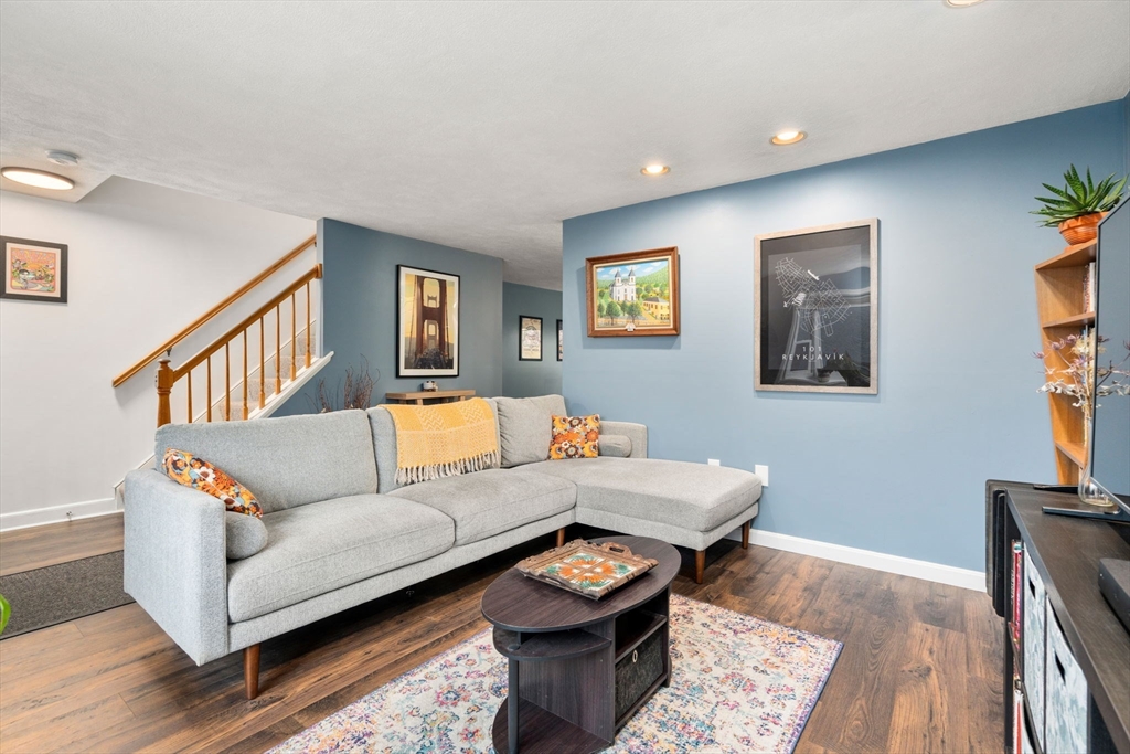 12 Oak Ridge Drive, Unit 3 Maynard, MA 01754 - Photo 3 of 34 a living room with furniture and a wooden floor