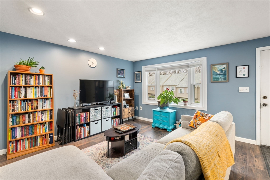 12 Oak Ridge Drive, Unit 3 Maynard, MA 01754 - Photo 5 of 34 a living room with furniture and a flat screen tv