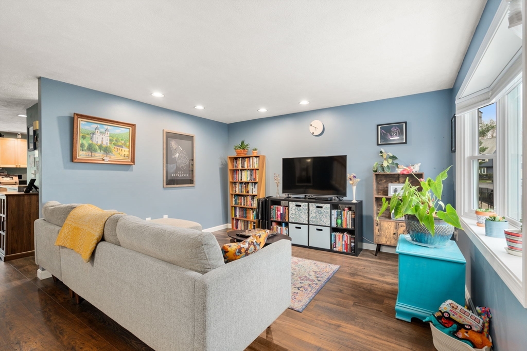 12 Oak Ridge Drive, Unit 3 Maynard, MA 01754 - Photo 6 of 34 a living room with furniture and a flat screen tv
