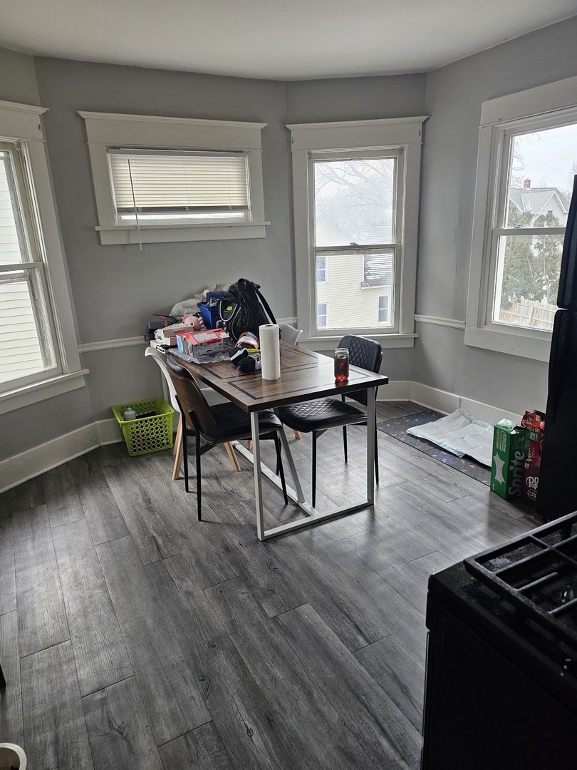 1115 14th Street Moline, IL 61265 - Photo 11 of 14 a living room with furniture and a wooden floor